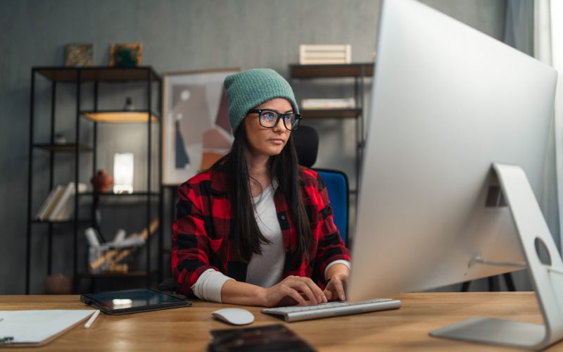 Female video editor works indoors in creative office studio